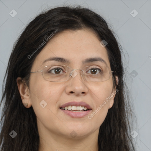 Joyful white adult female with long  brown hair and brown eyes