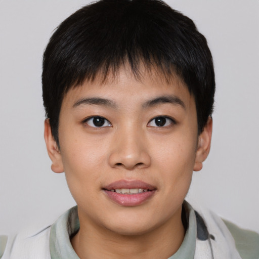 Joyful asian young-adult male with short  brown hair and brown eyes