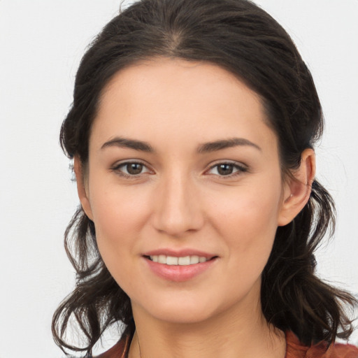 Joyful white young-adult female with long  brown hair and brown eyes