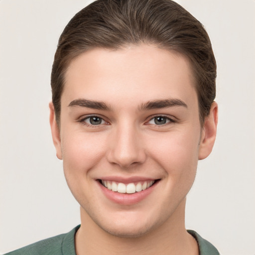 Joyful white young-adult female with short  brown hair and brown eyes