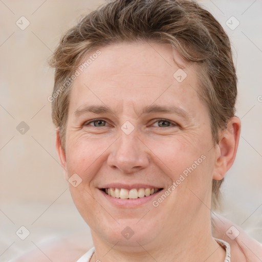 Joyful white adult female with short  brown hair and brown eyes