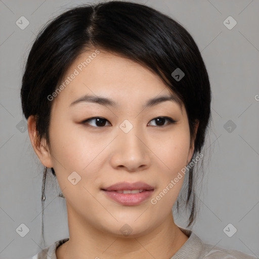 Joyful asian young-adult female with medium  black hair and brown eyes