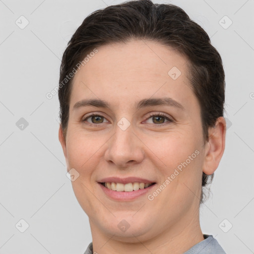 Joyful white young-adult female with short  brown hair and brown eyes