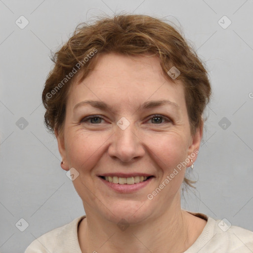 Joyful white adult female with medium  brown hair and grey eyes