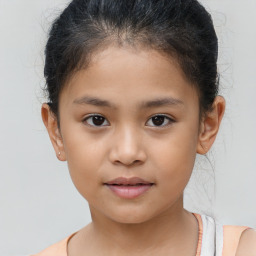 Joyful white child female with short  brown hair and brown eyes