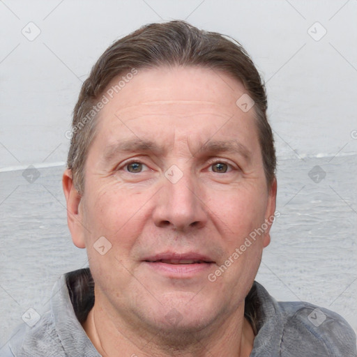 Joyful white adult male with short  brown hair and grey eyes