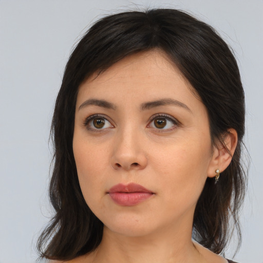 Joyful asian young-adult female with medium  brown hair and brown eyes