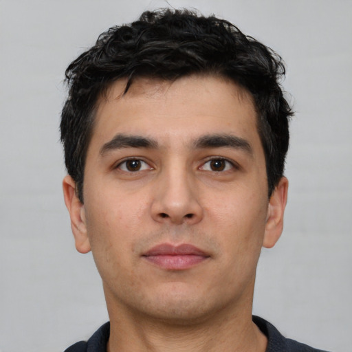 Neutral white young-adult male with short  black hair and brown eyes