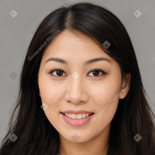 Joyful asian young-adult female with long  brown hair and brown eyes