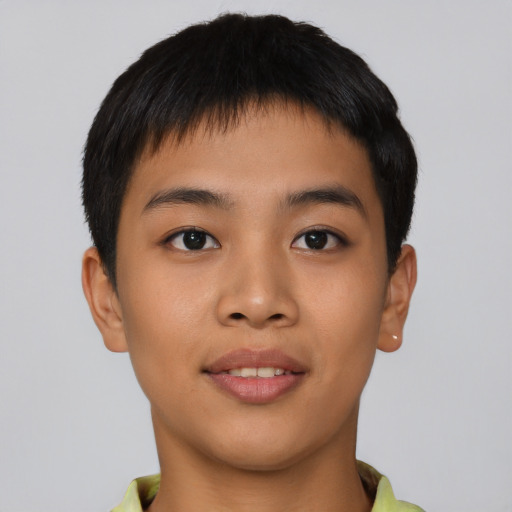 Joyful asian young-adult male with short  black hair and brown eyes