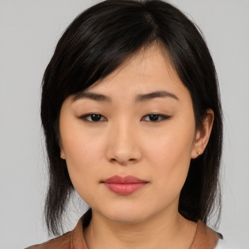 Neutral asian young-adult female with medium  black hair and brown eyes