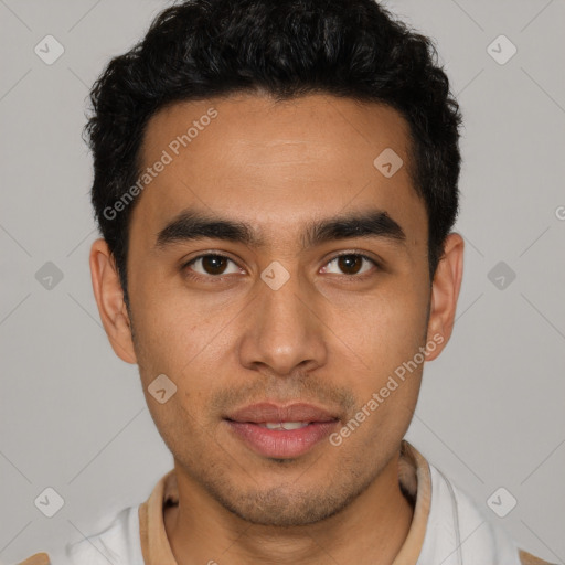 Joyful latino young-adult male with short  brown hair and brown eyes