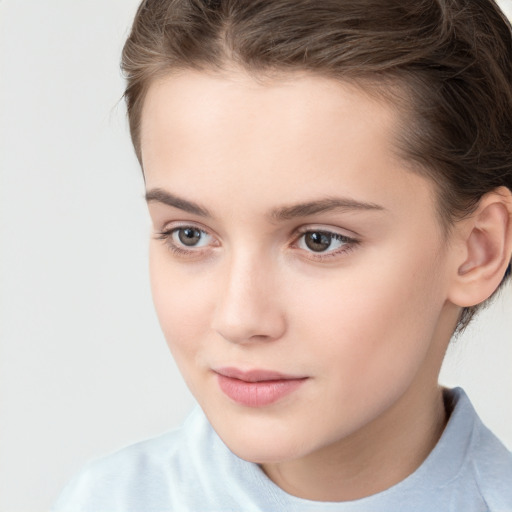 Joyful white child female with short  brown hair and brown eyes