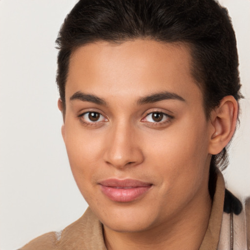 Joyful latino young-adult female with short  brown hair and brown eyes