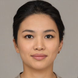 Joyful asian young-adult female with medium  brown hair and brown eyes