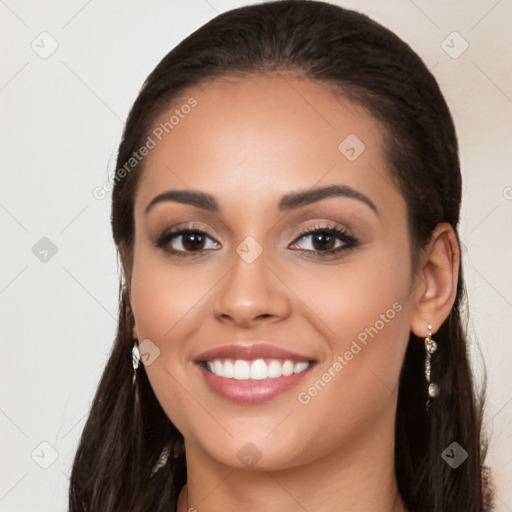 Joyful latino young-adult female with long  brown hair and brown eyes