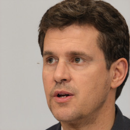 Neutral white adult male with short  brown hair and brown eyes