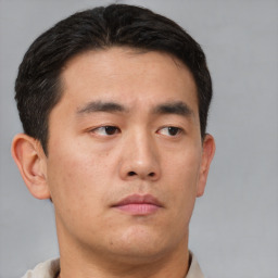 Neutral asian young-adult male with short  brown hair and brown eyes