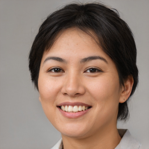 Joyful white young-adult female with medium  brown hair and brown eyes