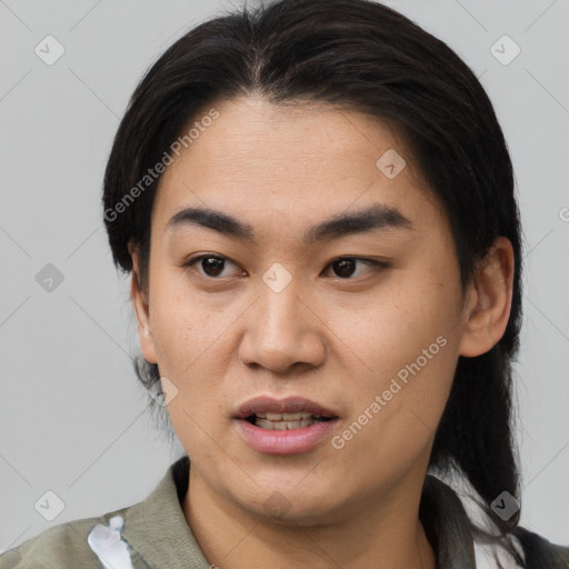 Joyful asian young-adult female with medium  black hair and brown eyes