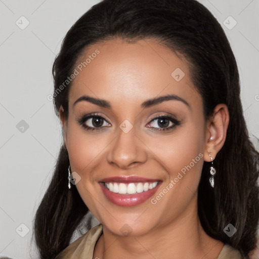 Joyful latino young-adult female with long  brown hair and brown eyes