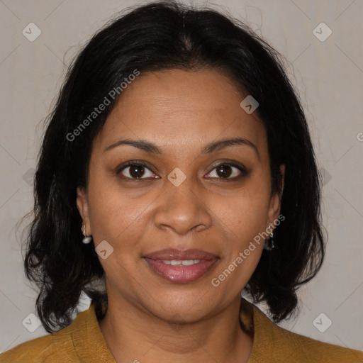 Joyful black adult female with medium  brown hair and brown eyes