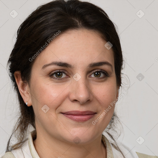 Joyful white adult female with medium  brown hair and grey eyes