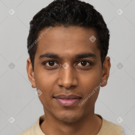 Joyful black young-adult male with short  black hair and brown eyes