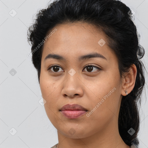 Joyful latino young-adult female with medium  brown hair and brown eyes