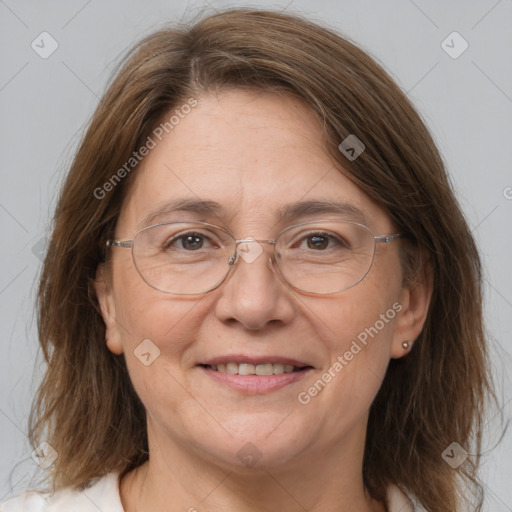 Joyful white adult female with medium  brown hair and grey eyes