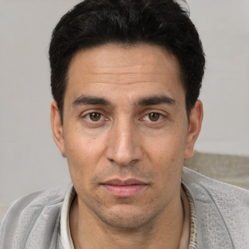 Neutral white adult male with short  black hair and brown eyes