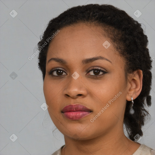 Joyful black young-adult female with medium  brown hair and brown eyes