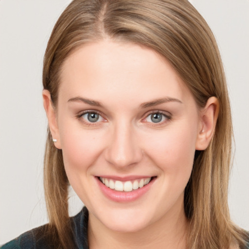 Joyful white young-adult female with long  brown hair and grey eyes