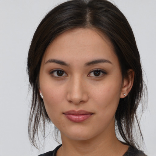 Joyful white young-adult female with medium  brown hair and brown eyes