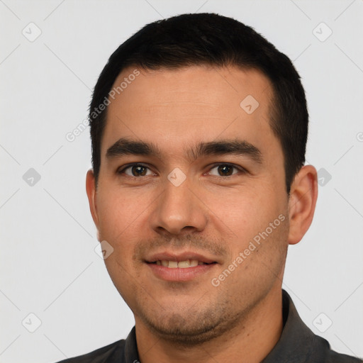 Joyful white young-adult male with short  black hair and brown eyes