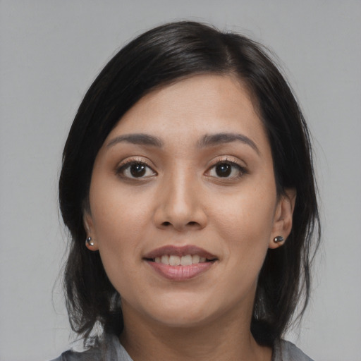 Joyful asian young-adult female with medium  black hair and brown eyes