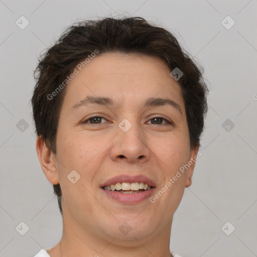 Joyful white adult female with short  brown hair and brown eyes