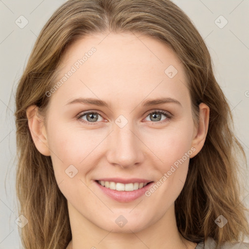 Joyful white young-adult female with long  brown hair and grey eyes