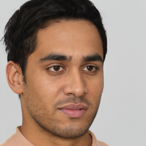 Neutral latino young-adult male with short  brown hair and brown eyes