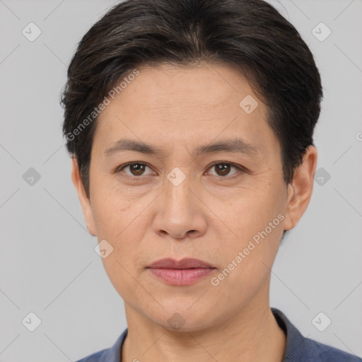 Joyful white adult female with short  brown hair and brown eyes