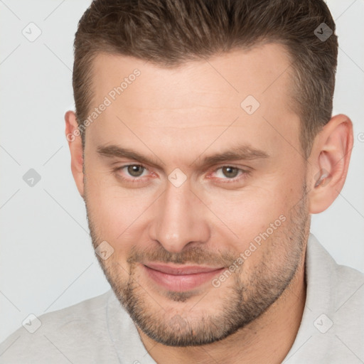 Joyful white adult male with short  brown hair and brown eyes