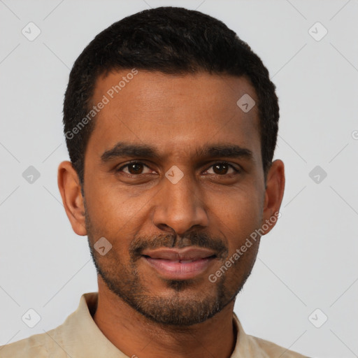 Joyful black young-adult male with short  black hair and brown eyes