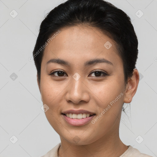 Joyful asian young-adult female with short  brown hair and brown eyes