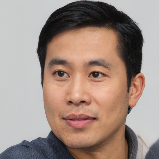 Neutral asian young-adult male with short  black hair and brown eyes