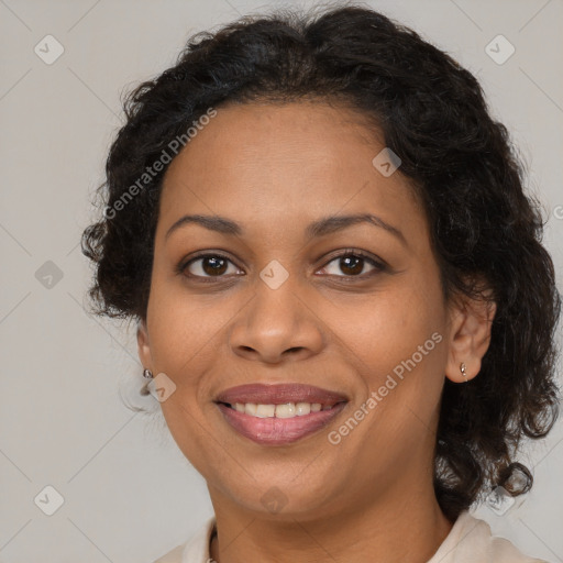 Joyful latino adult female with medium  brown hair and brown eyes