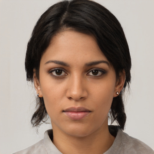 Neutral latino young-adult female with medium  black hair and brown eyes