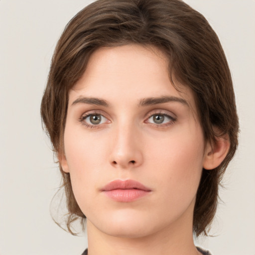 Neutral white young-adult female with medium  brown hair and green eyes