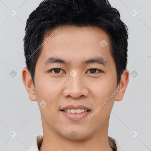 Joyful asian young-adult male with short  brown hair and brown eyes