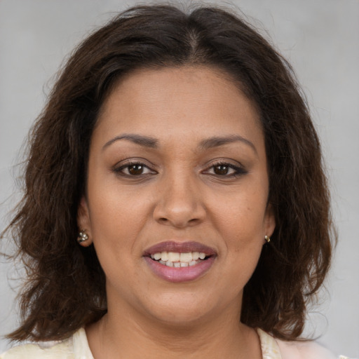 Joyful white young-adult female with medium  brown hair and brown eyes