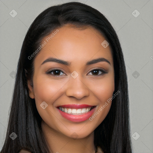 Joyful latino young-adult female with long  black hair and brown eyes